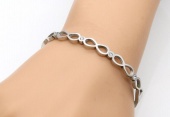 stainless steel infinity bangle with crystal