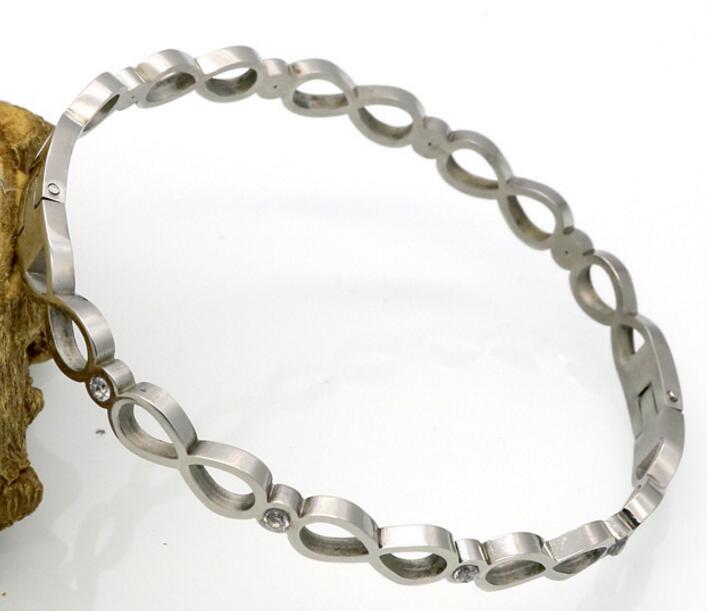 stainless steel infinity bangle with crystal